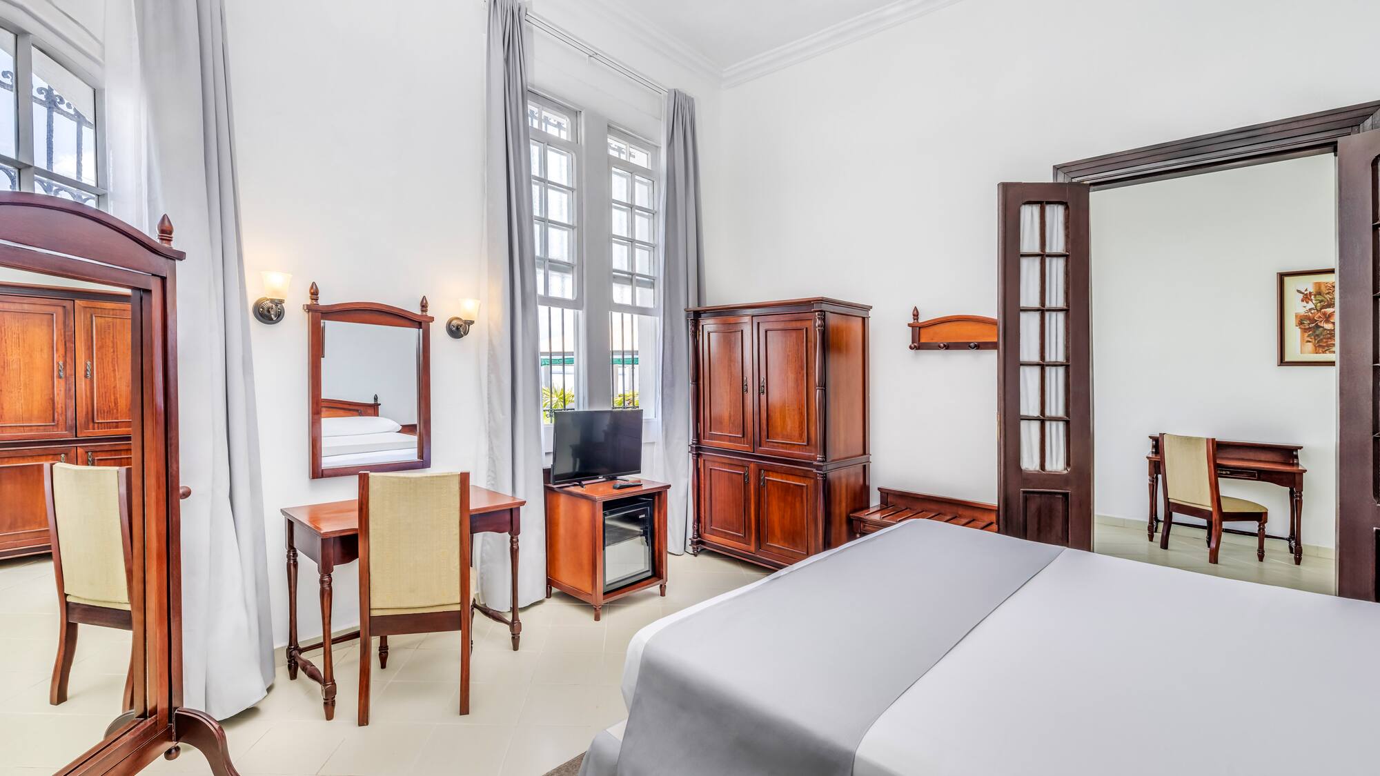 a room with a bed and a desk