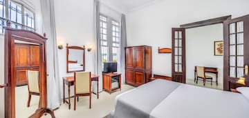 a room with a bed and a desk