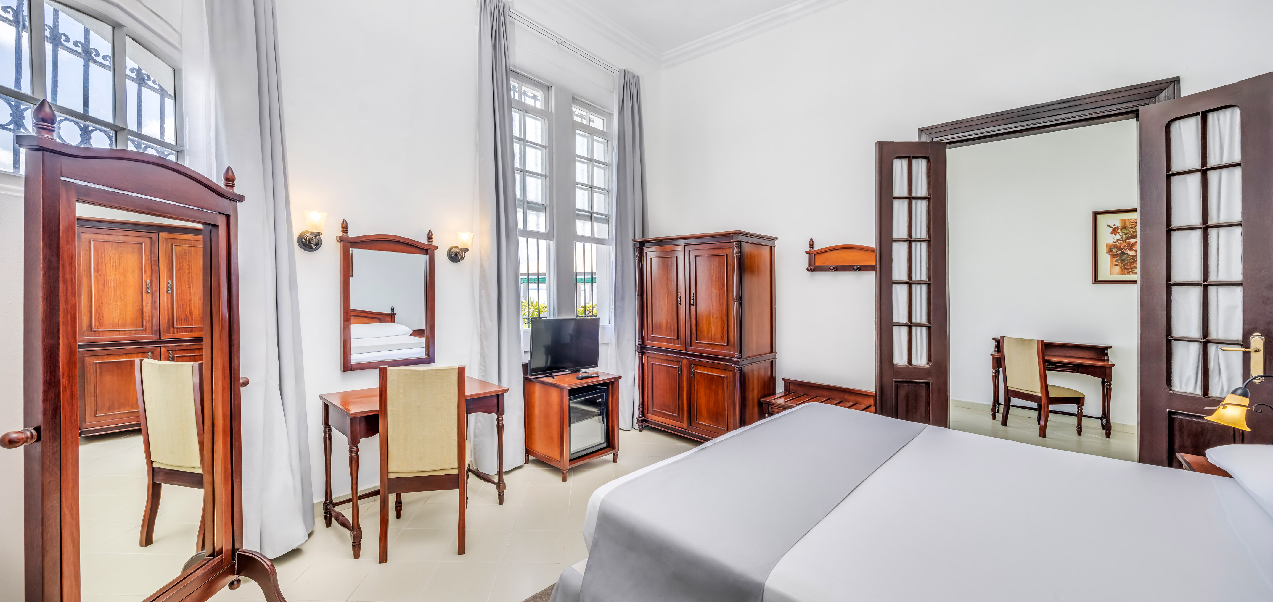 a room with a bed and a desk