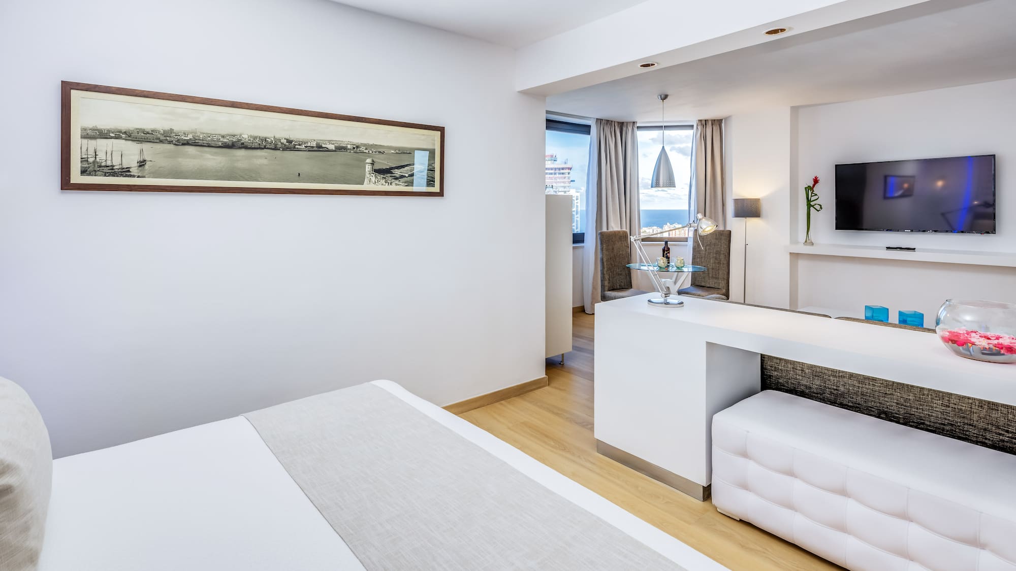 a room with a bed and a tv