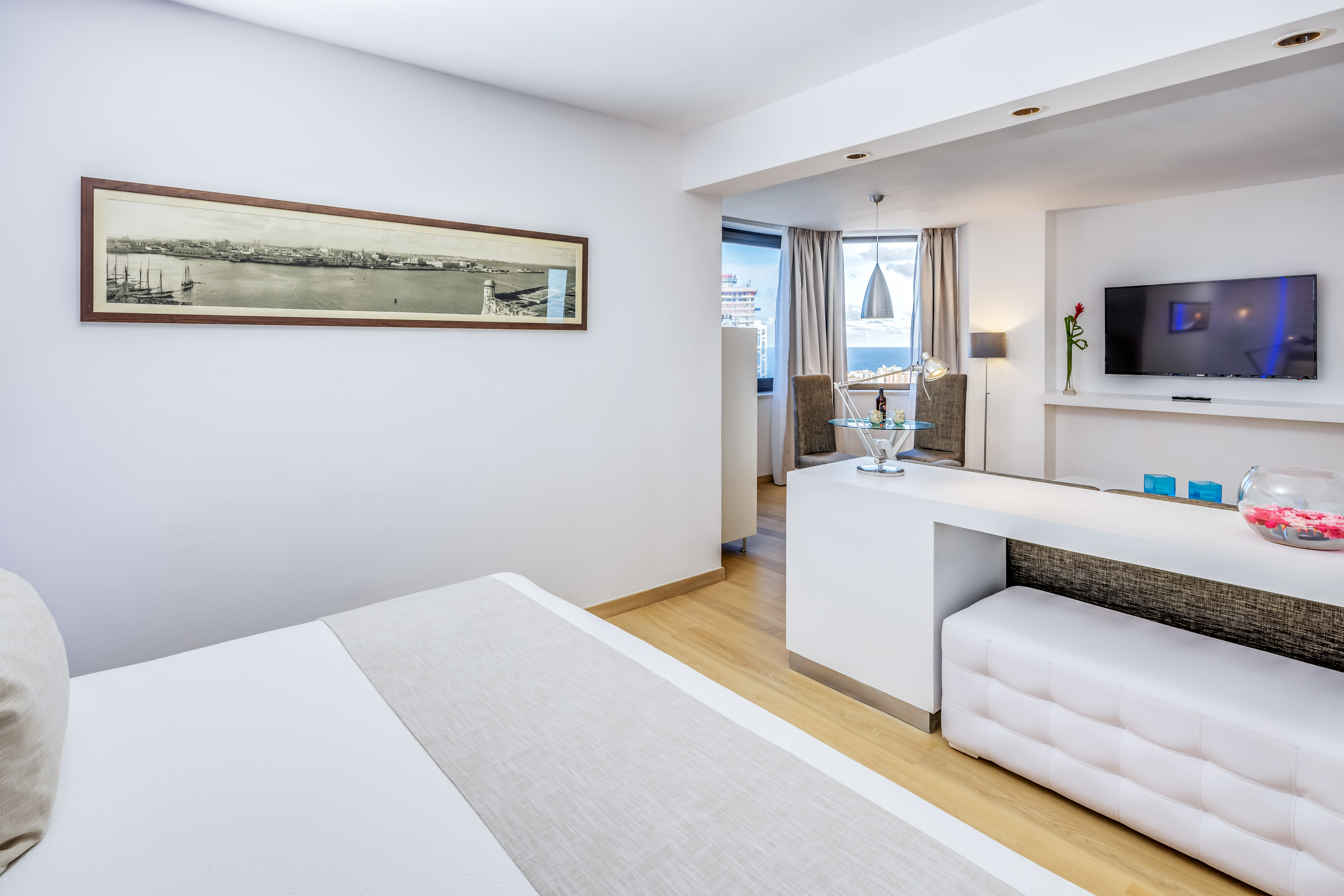 a room with a bed and a tv