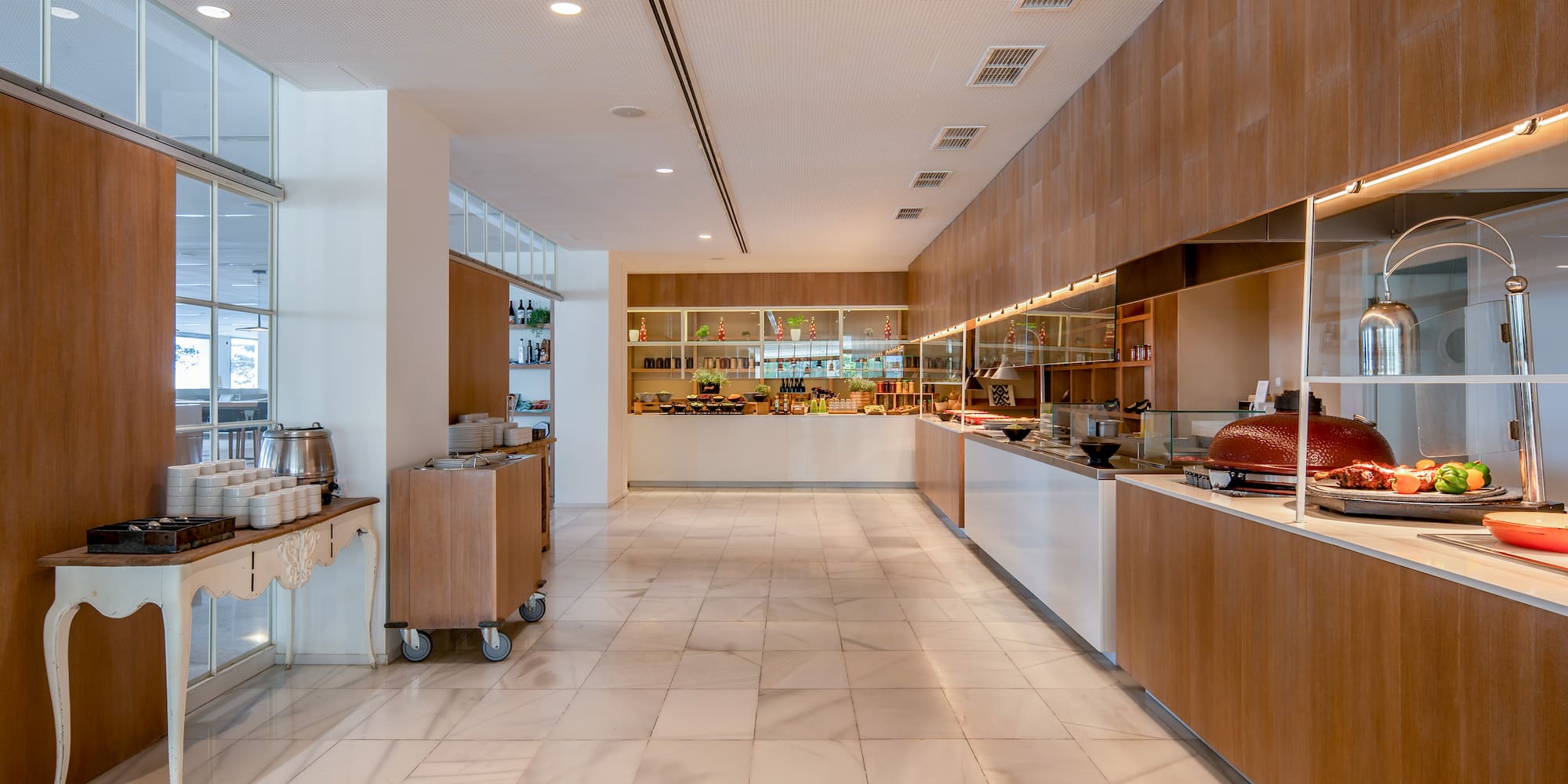 a large room with a buffet and a counter