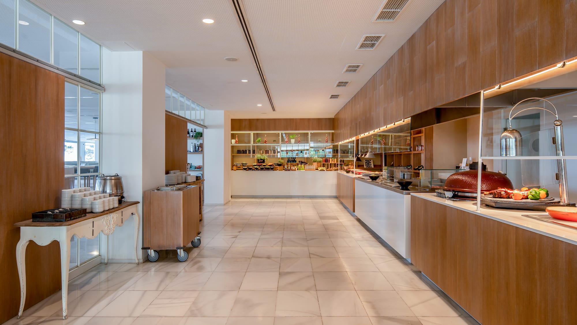 a large room with a buffet and a counter