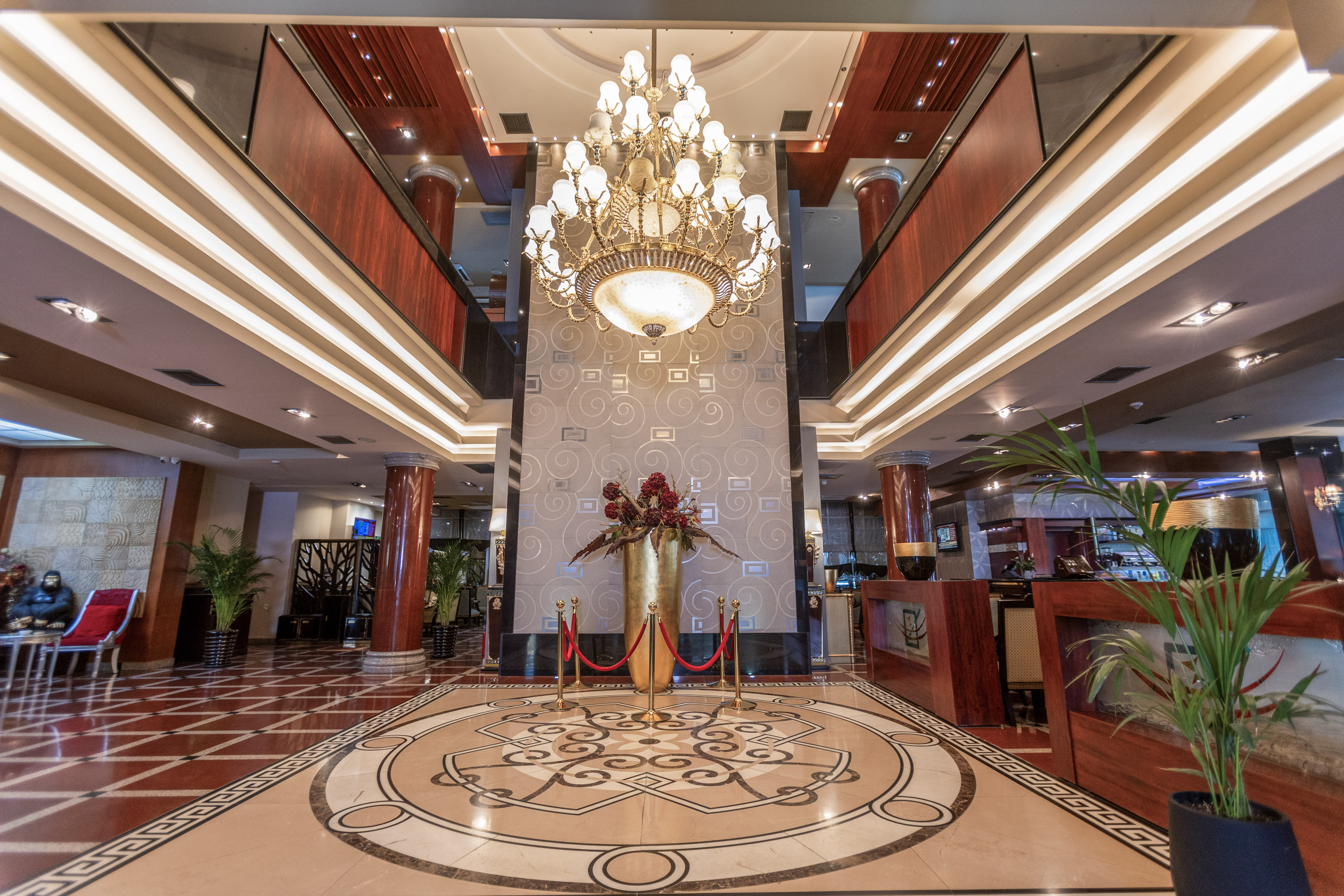 Luxury hotel lobby featuring a grand chandelier and intricate marble floor design. - Shkodër Grand Hotel Europa Affiliated by Meliá, Shkodër