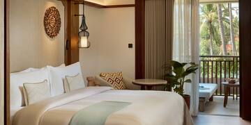 a bedroom with a bed and a tub