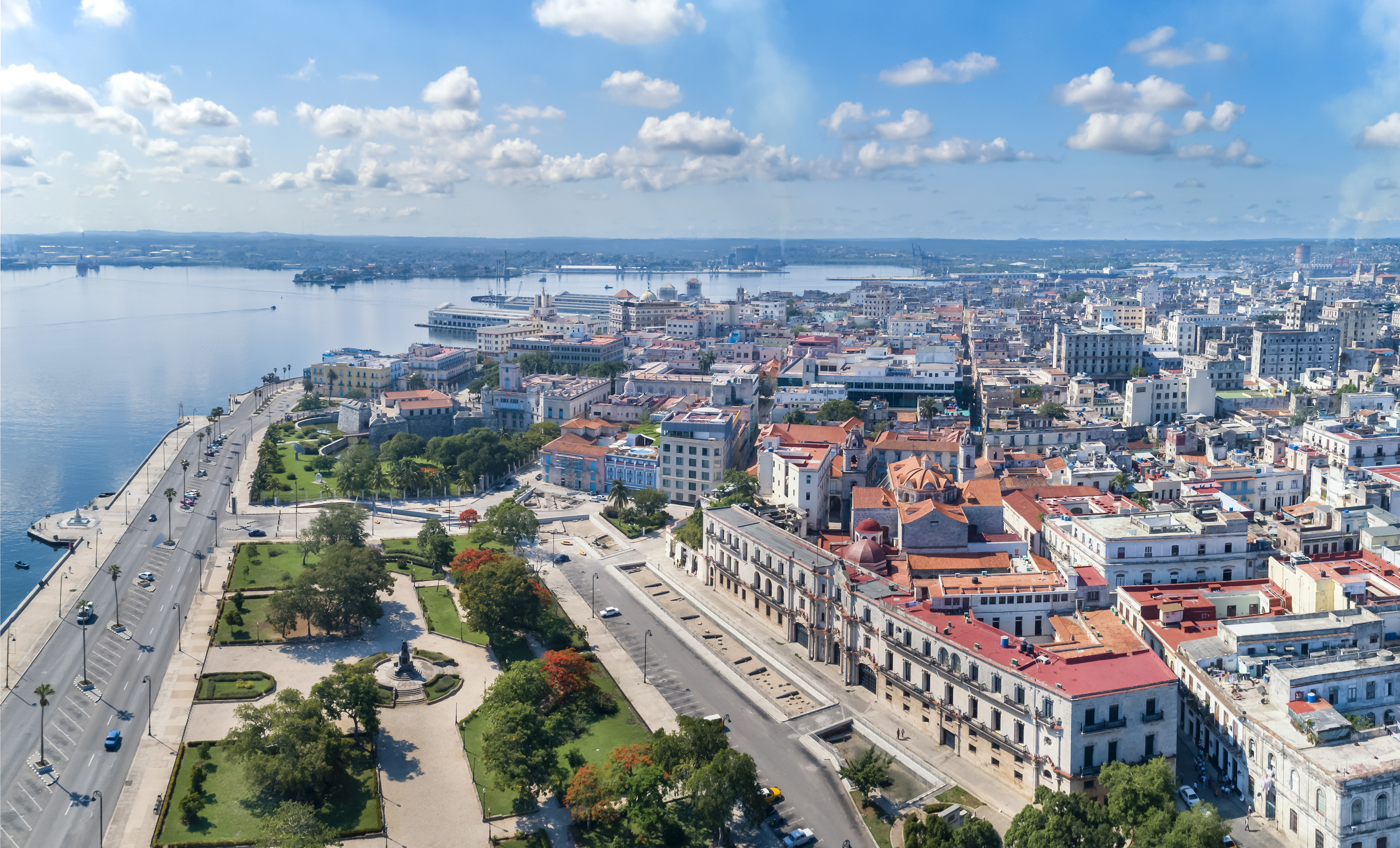 a city with many buildings and a body of water
