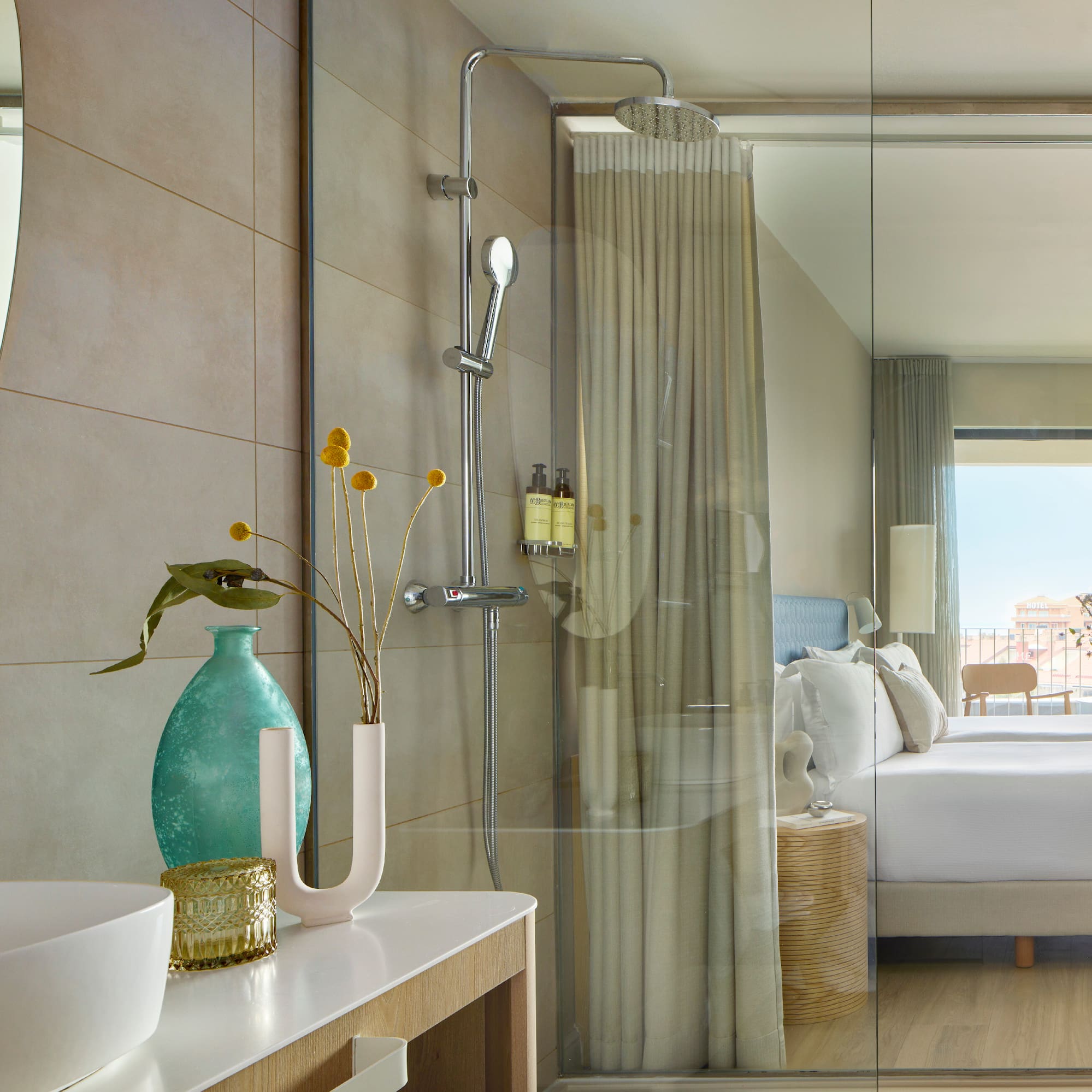 a bathroom with a shower and a bed