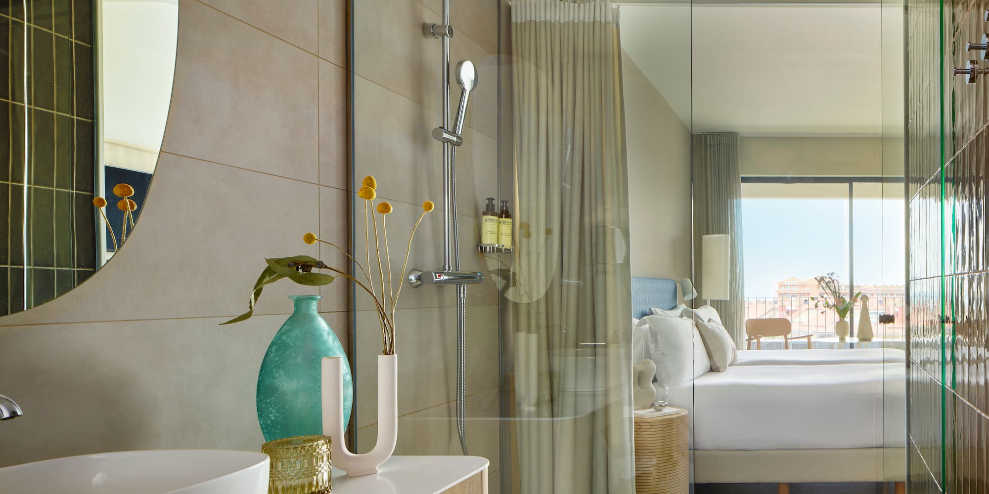 a bathroom with a shower and a bed