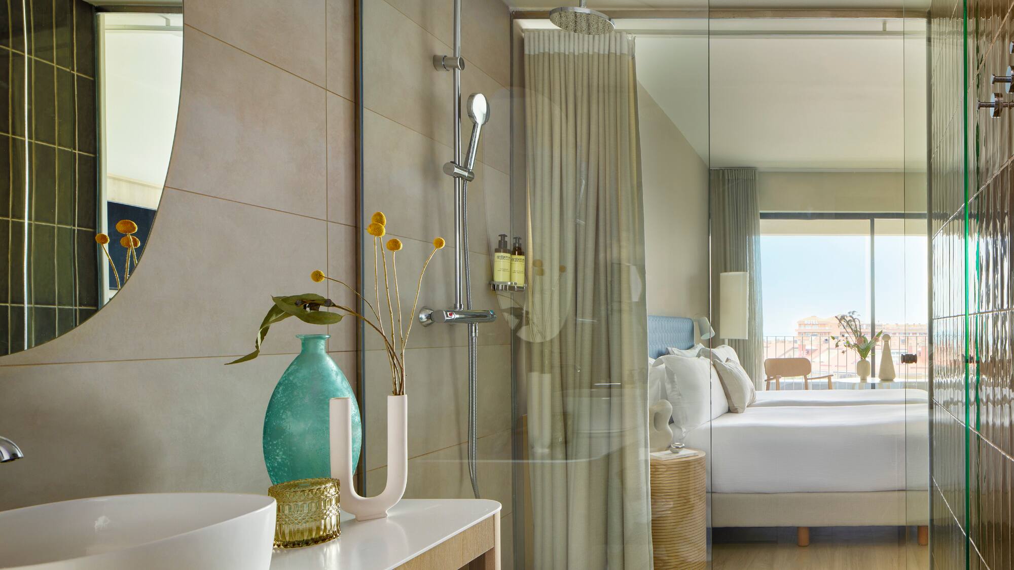 a bathroom with a shower and a bed