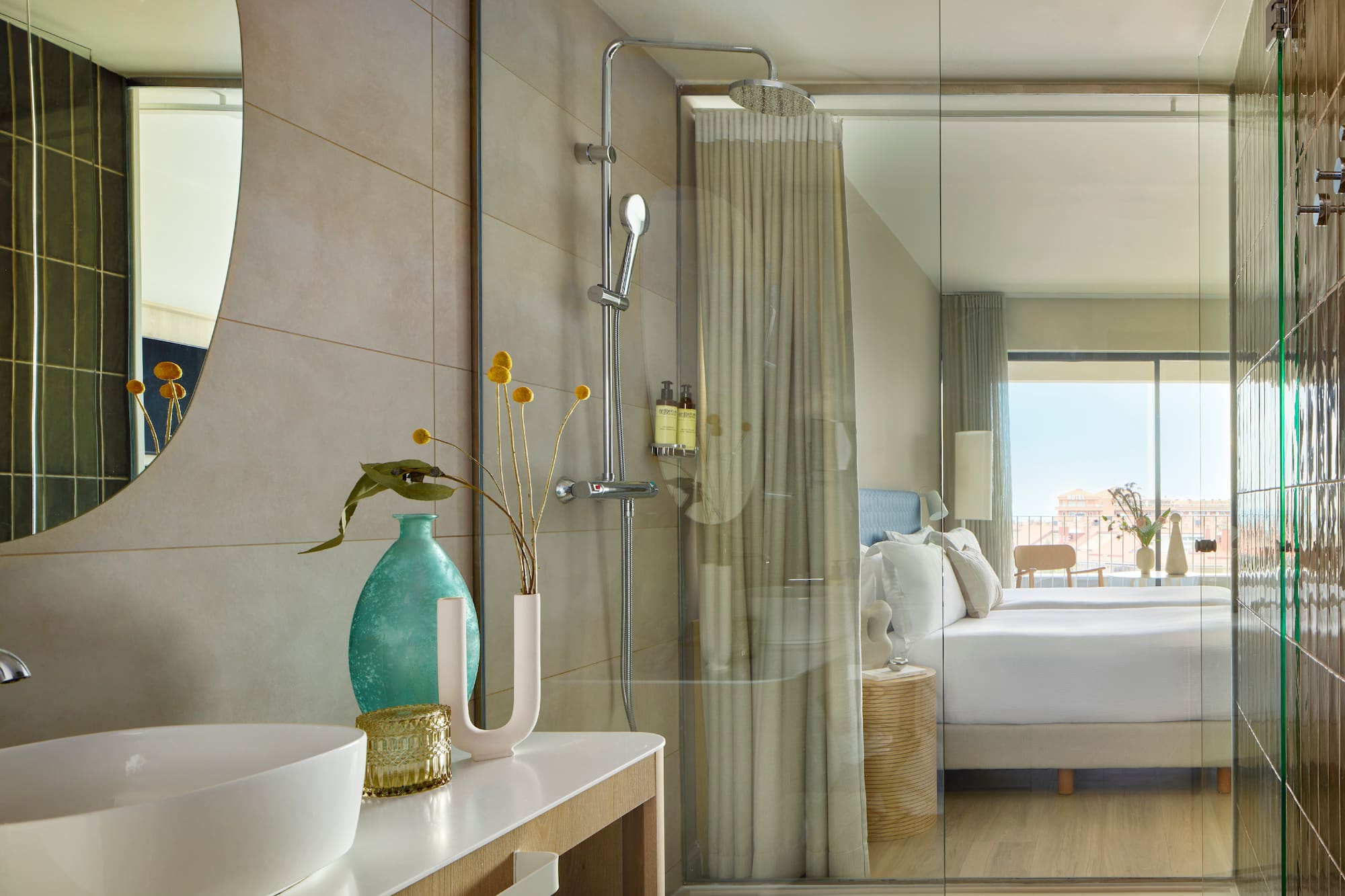 a bathroom with a shower and a bed