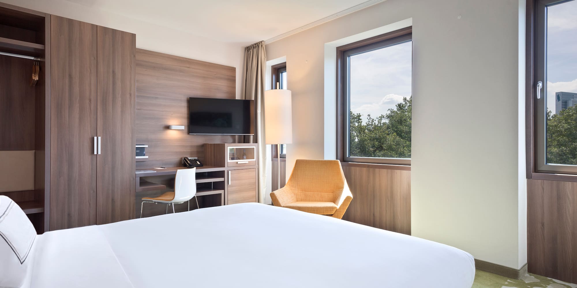 a room with a bed and a chair