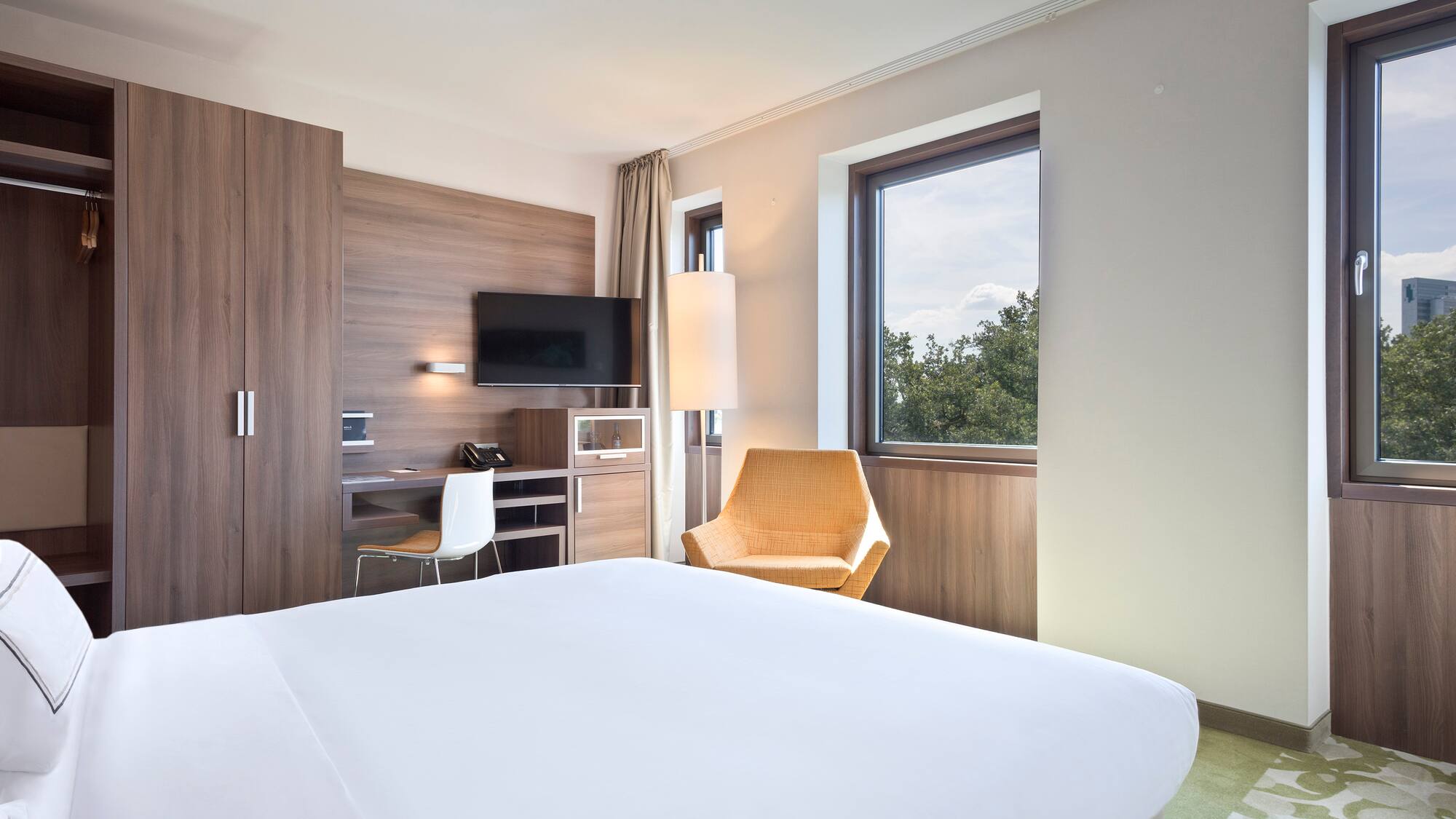 a room with a bed and a chair