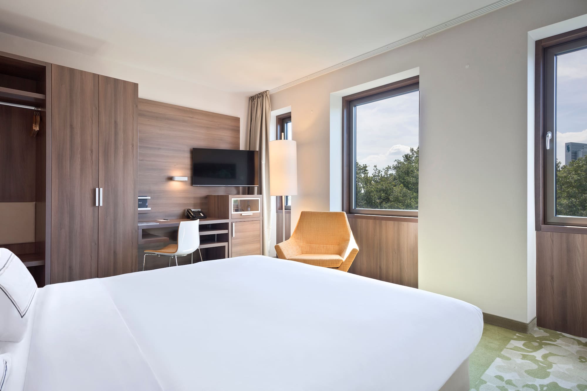 a room with a bed and a chair