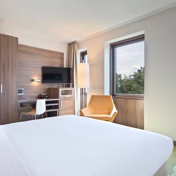 a room with a bed and a chair