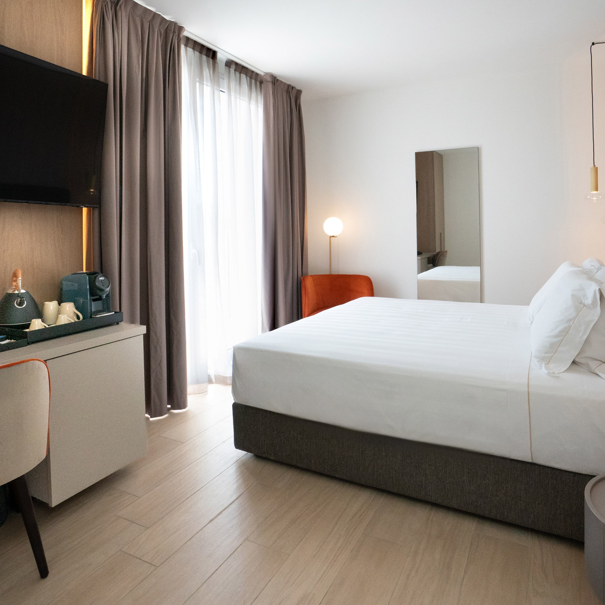 a room with a bed and a mirror