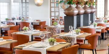 a restaurant with tables and chairs