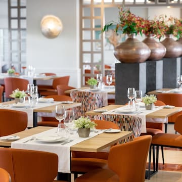 a restaurant with tables and chairs