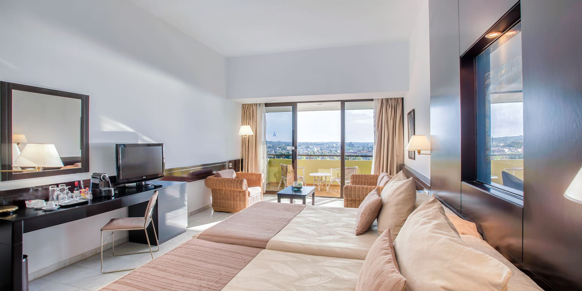 a room with a television and a large bed