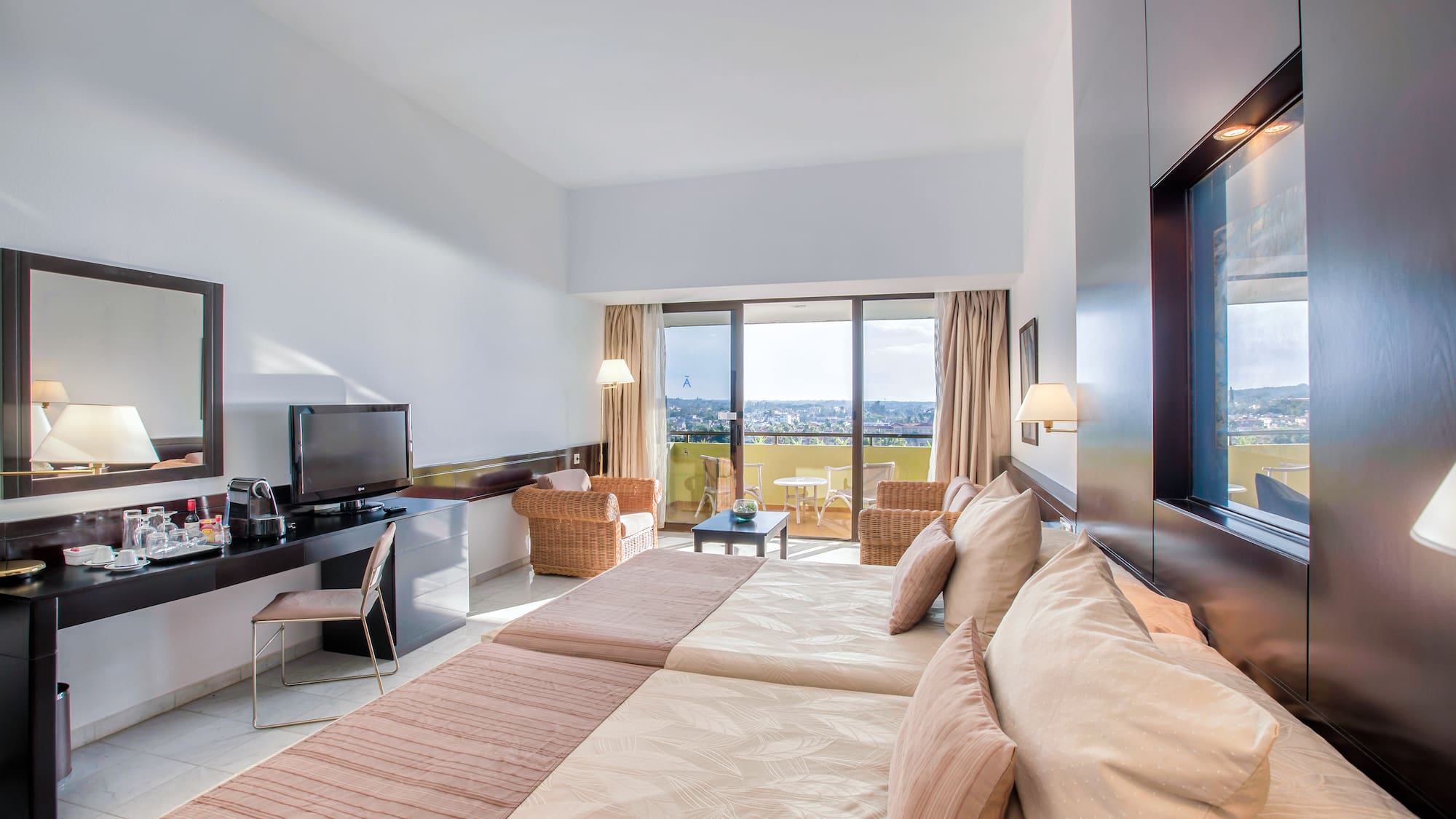 a room with a television and a large bed