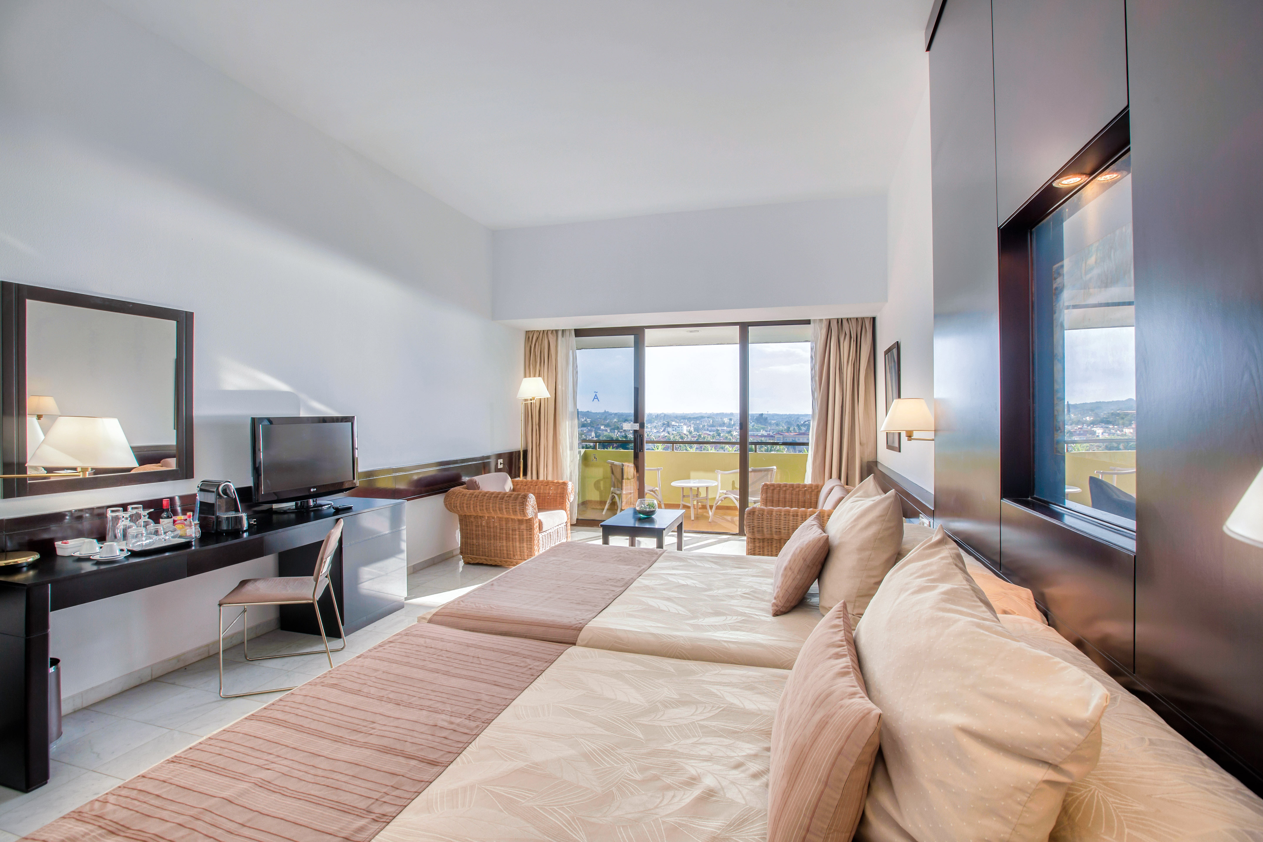 a room with a television and a large bed