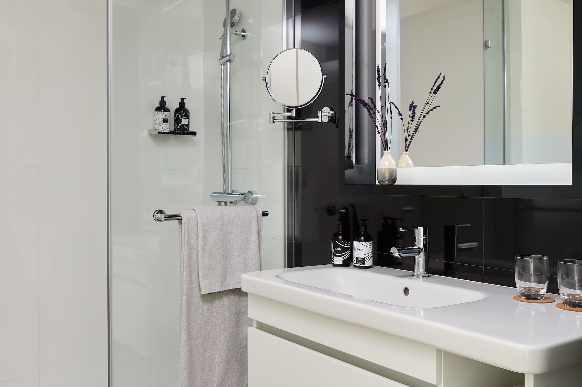 a bathroom with a shower and sink