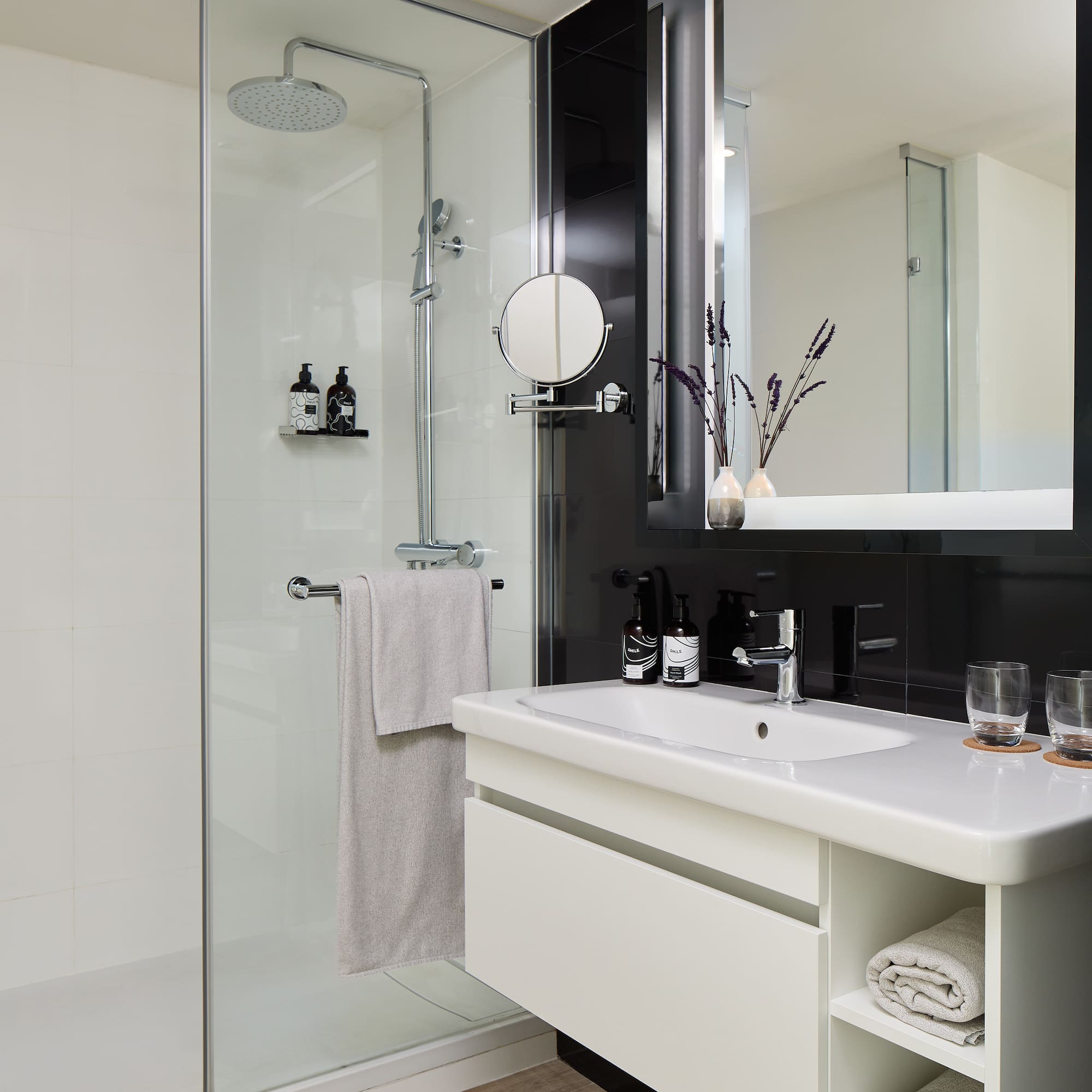 a bathroom with a shower and sink