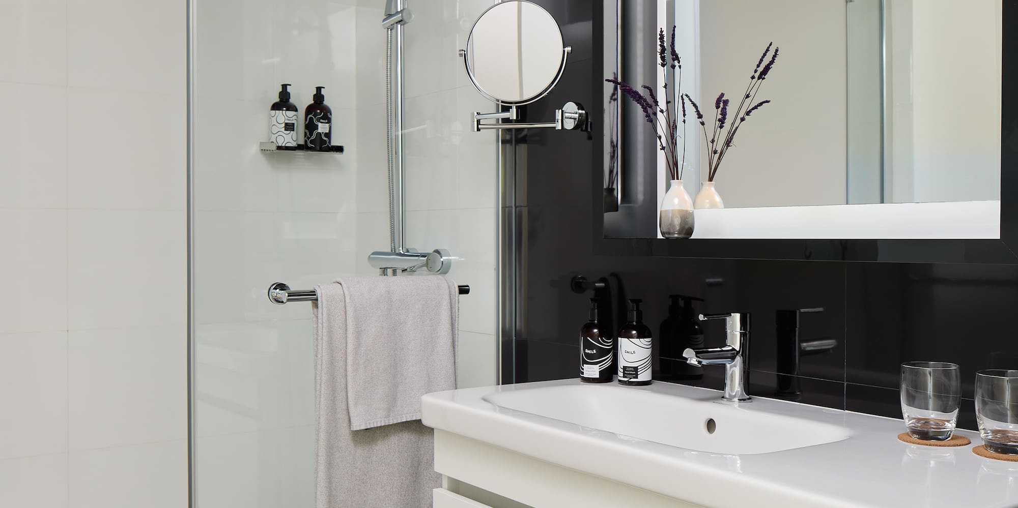 a bathroom with a shower and sink