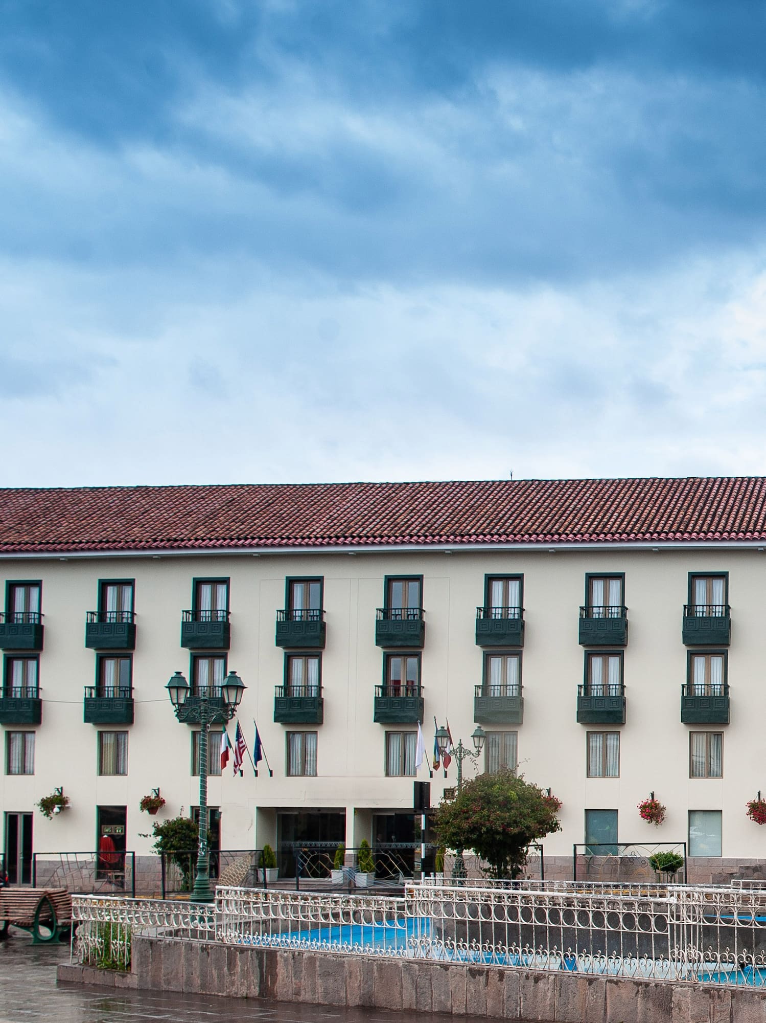 a building with a pool in front of it