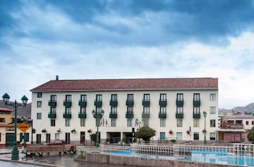 a building with a pool in front of it