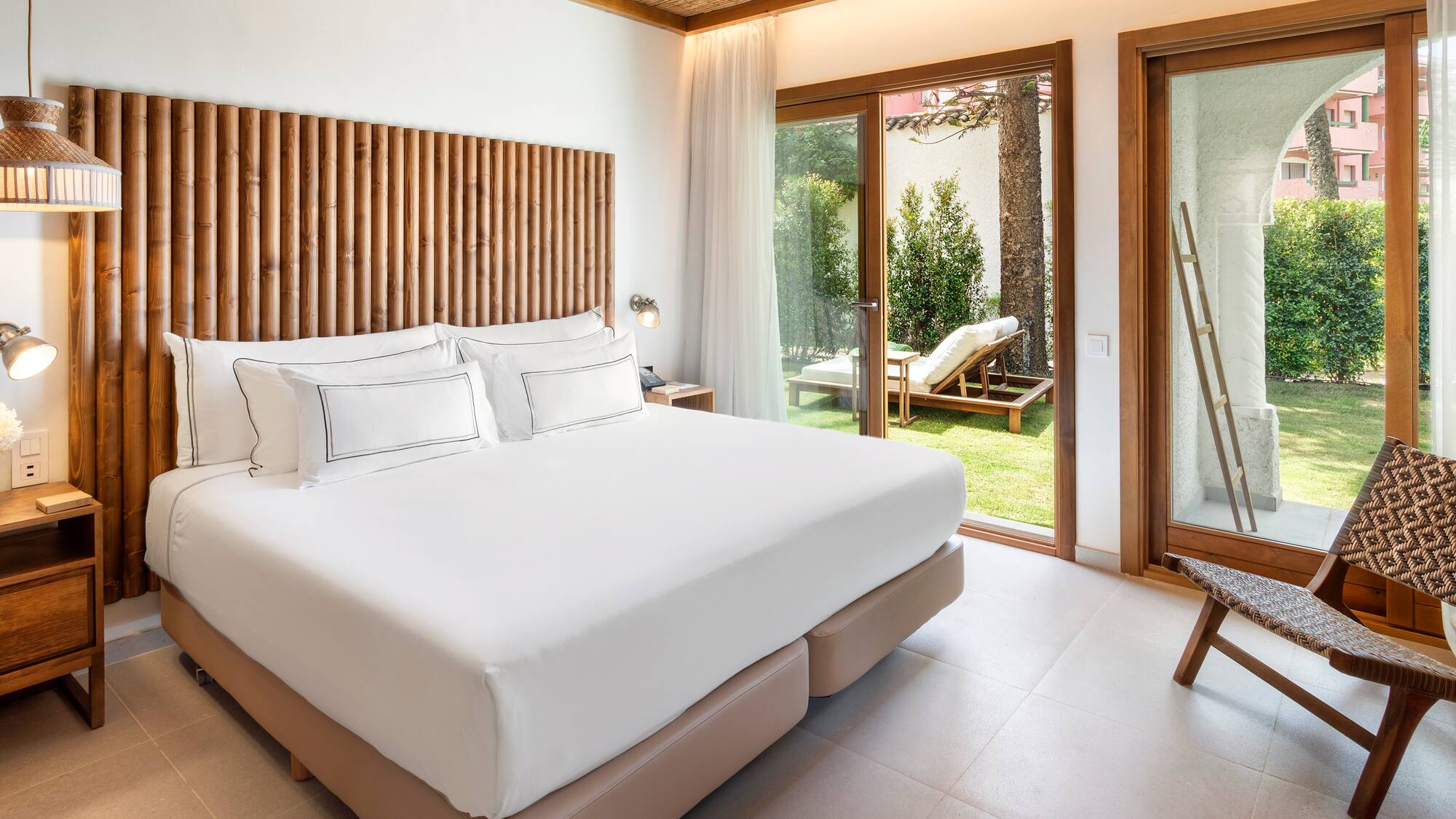 a bed in a room with a glass door