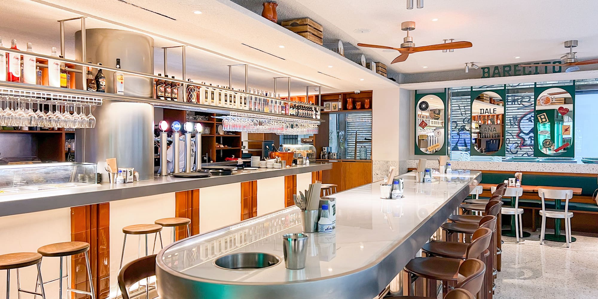 a bar with a counter and chairs