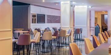 a room with tables and chairs