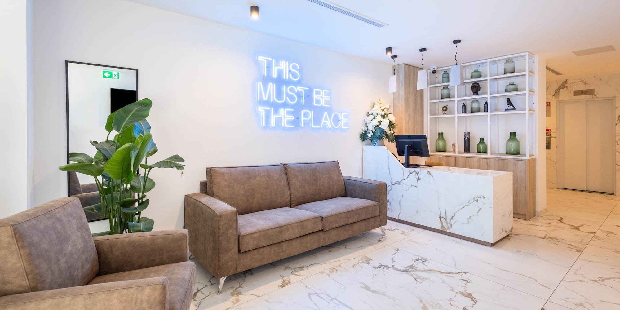 a room with a reception desk and a couch