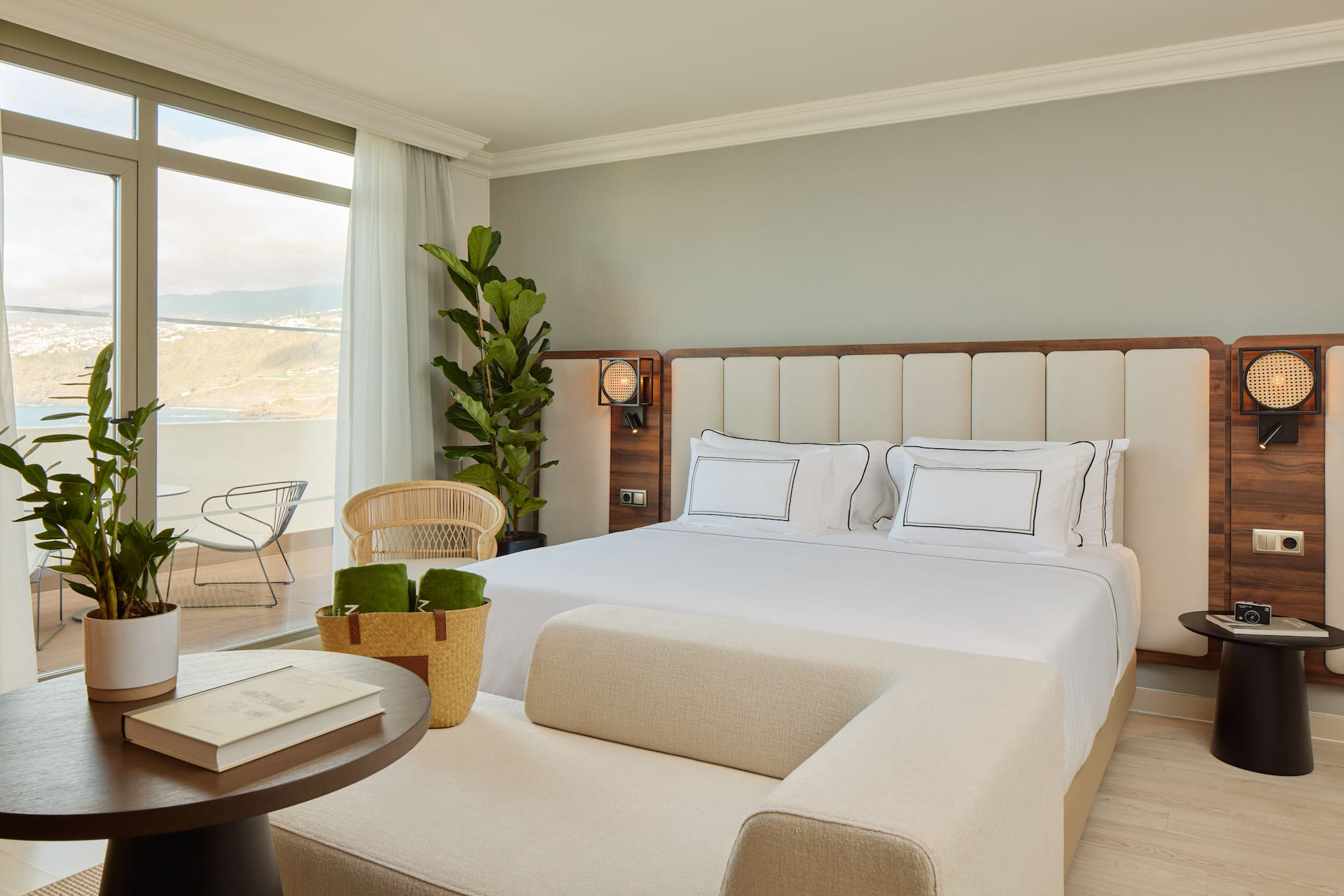 a bedroom with a large bed and a table