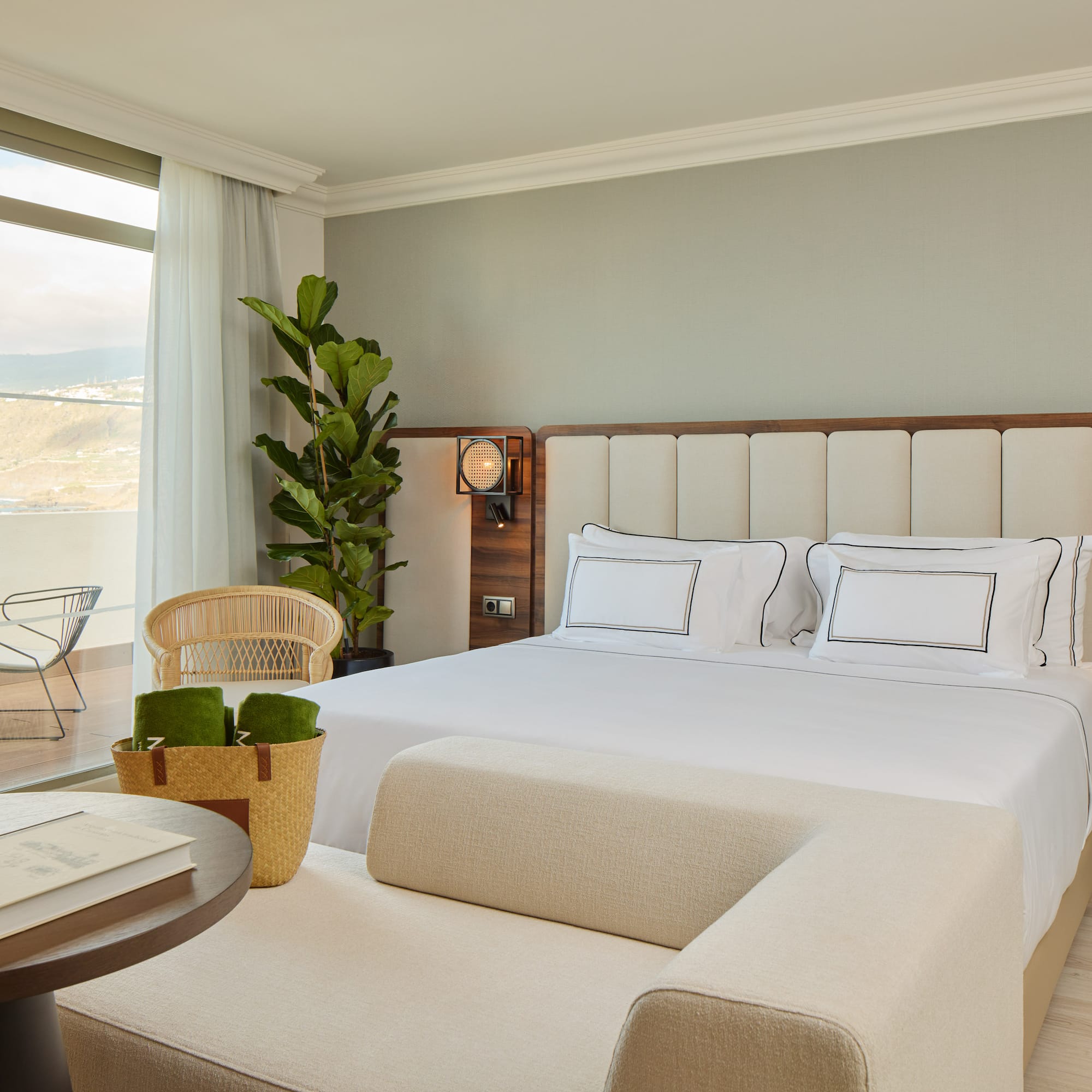 a bedroom with a large bed and a table