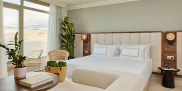 a bedroom with a large bed and a table