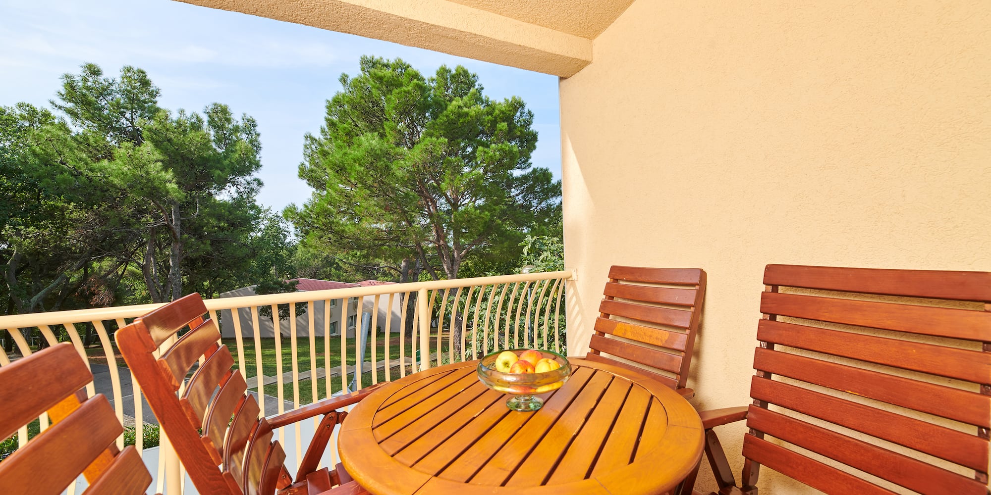 a table and chairs on a balcony