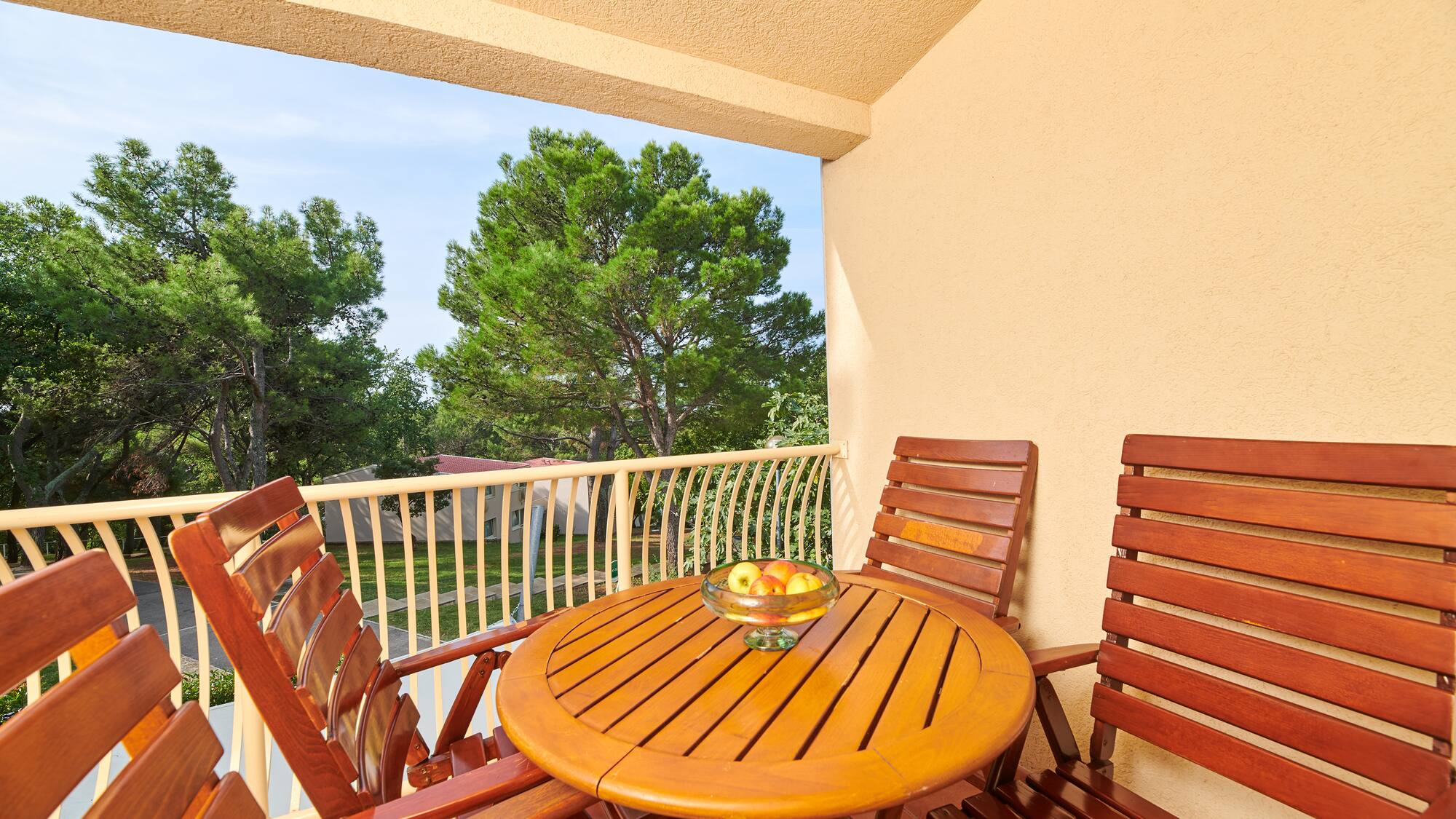 a table and chairs on a balcony