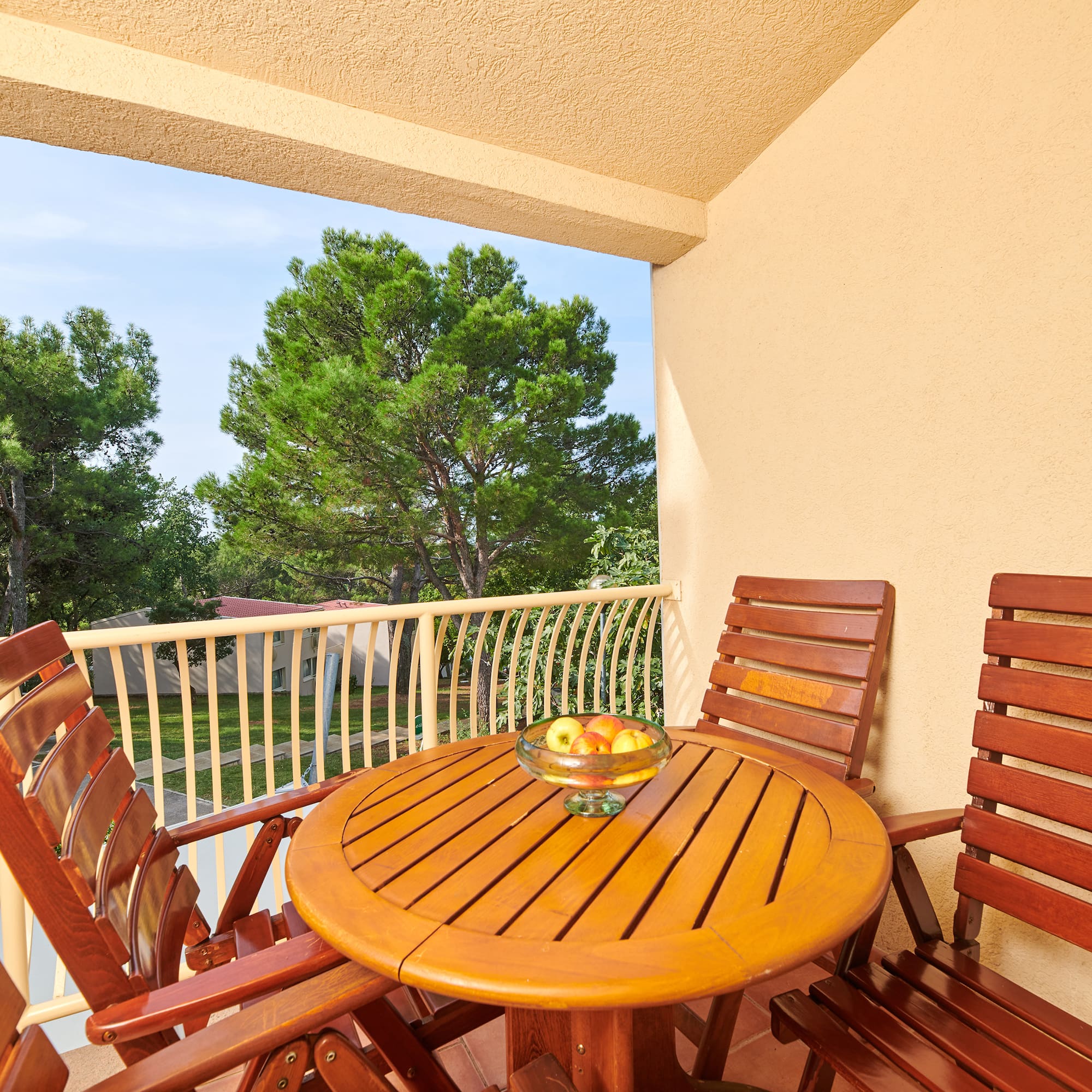 a table and chairs on a balcony