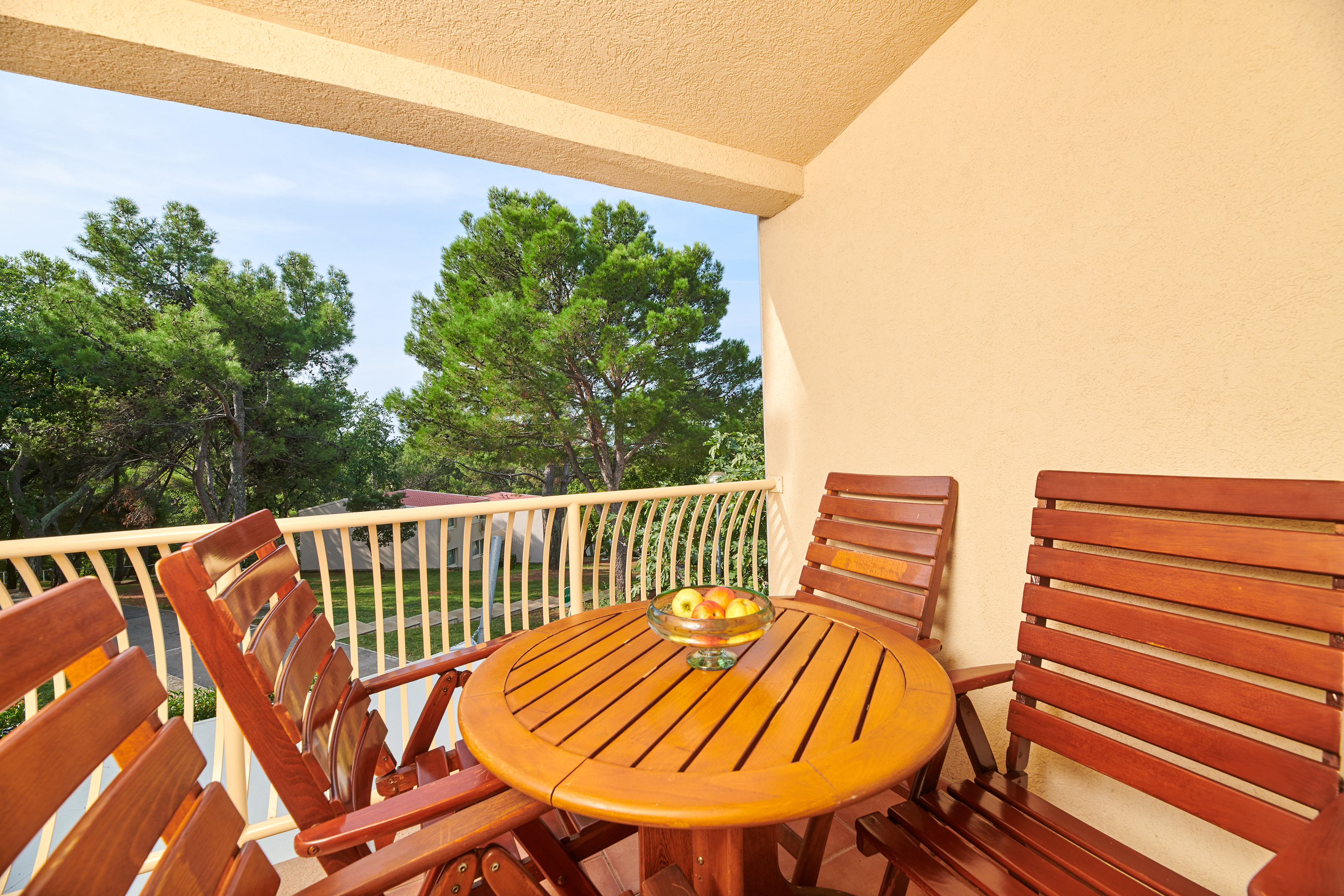 a table and chairs on a balcony
