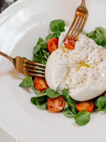 a plate of food with fork and knife