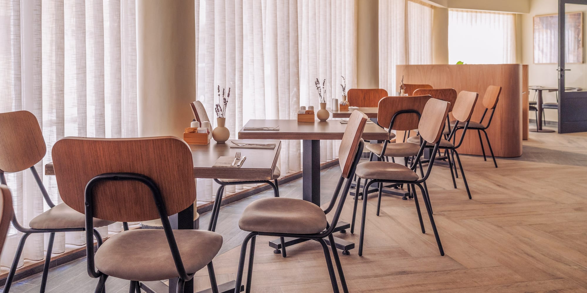 a room with tables and chairs