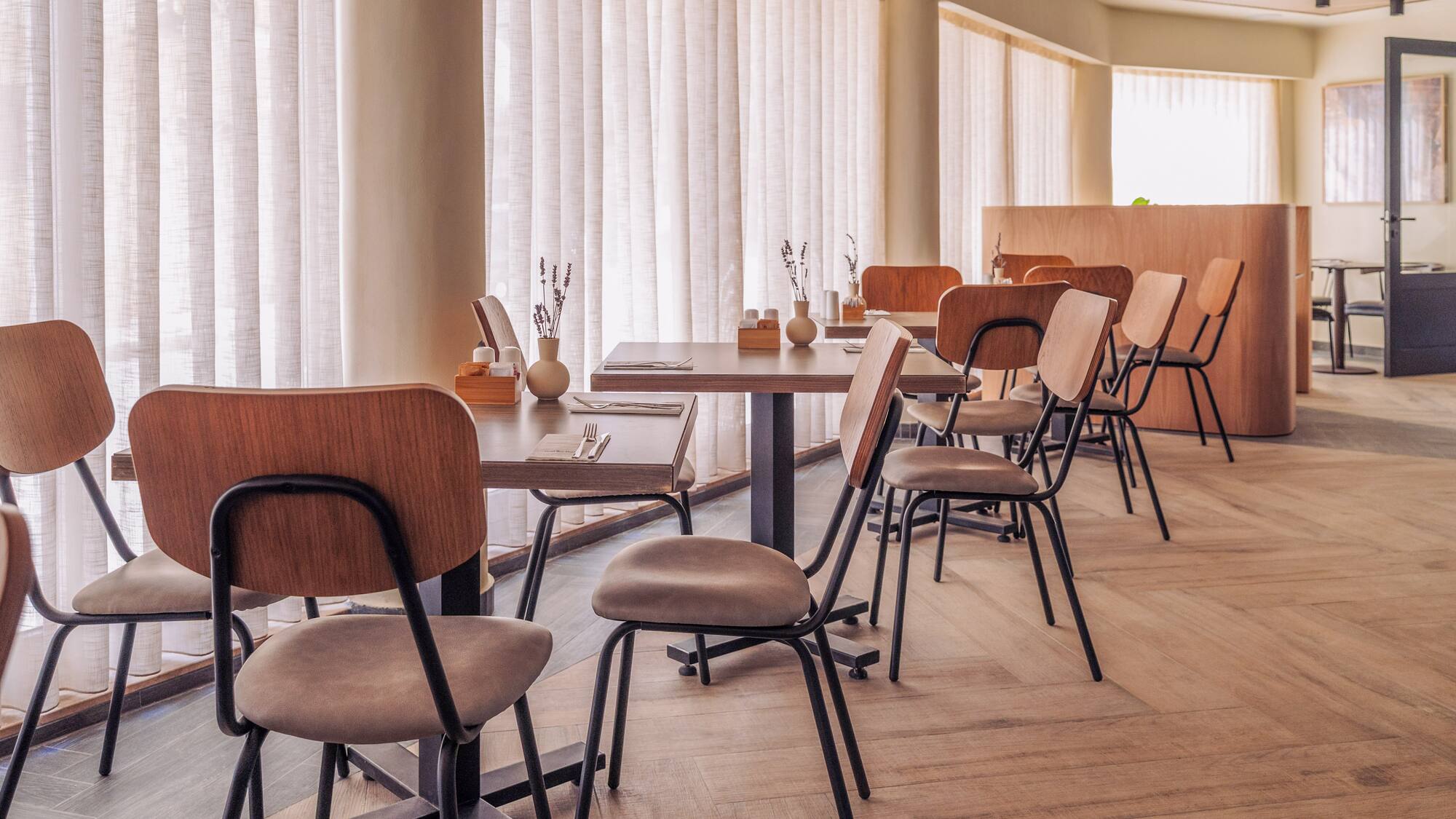 a room with tables and chairs