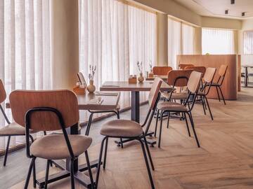 a room with tables and chairs