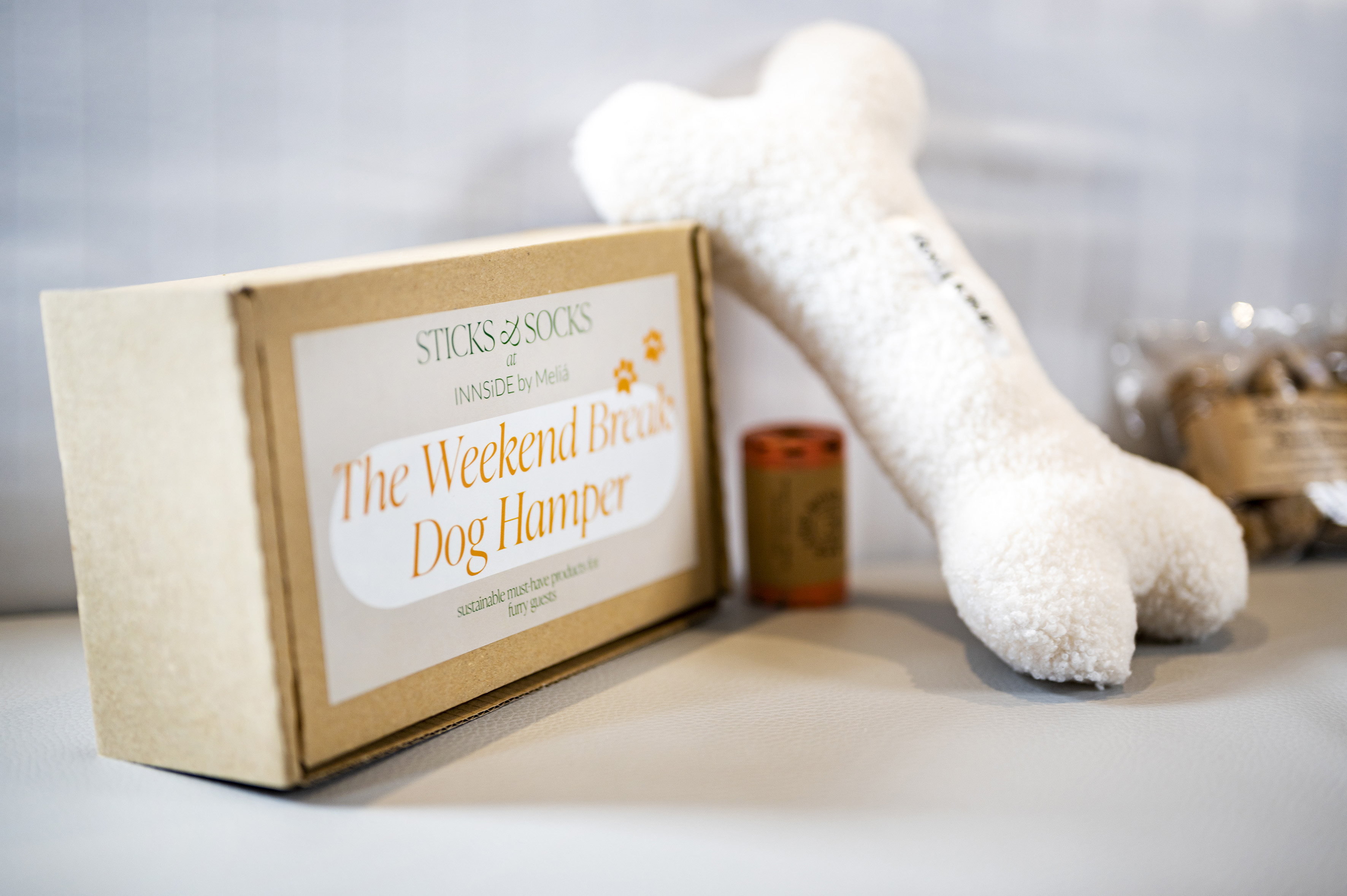 Sticks & Socks Weekend Break Dog Hamper box, bone toy, treats. Sustainable for pets.