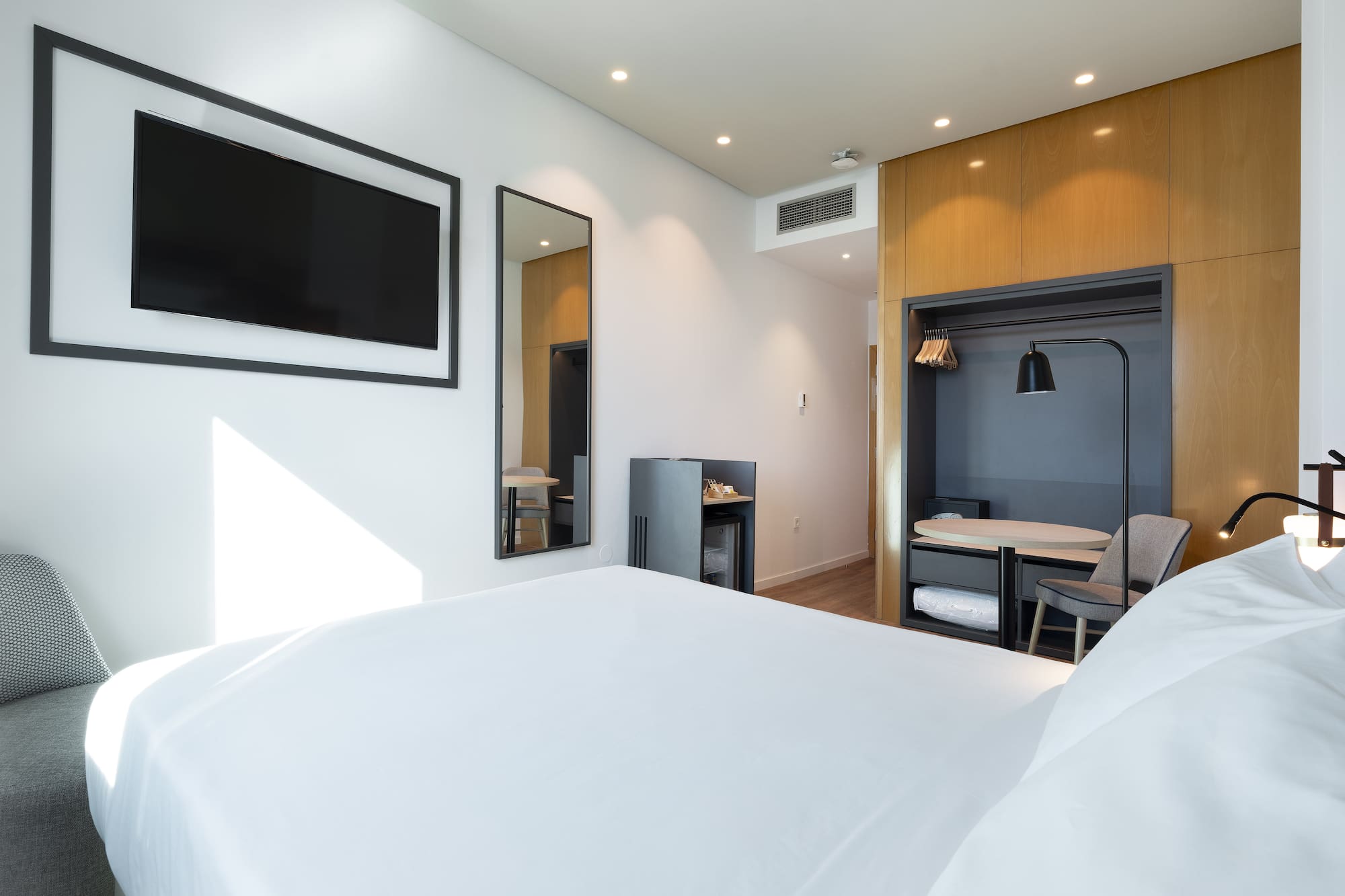 a room with a bed and a tv