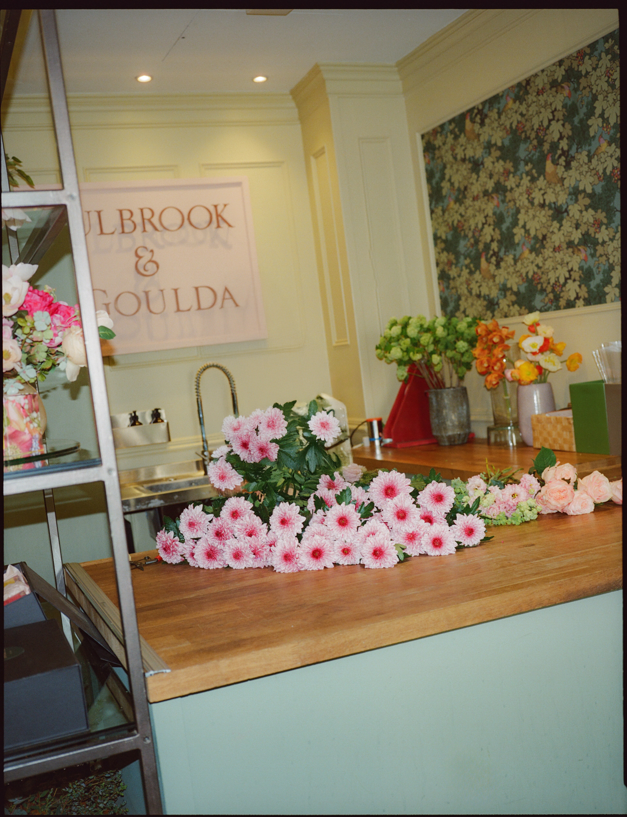 a bunch of flowers on a counter