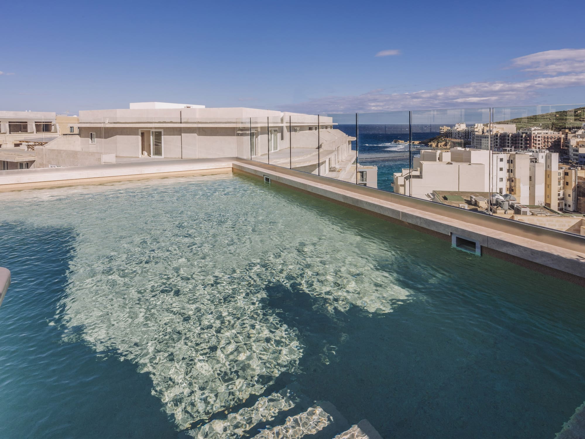 a pool with a building in the background