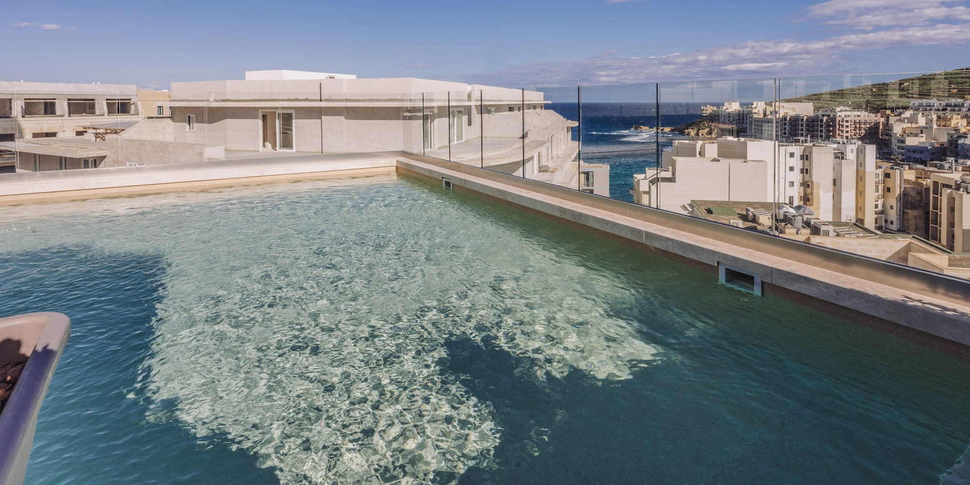 a pool with a building in the background