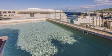 a pool with a building in the background